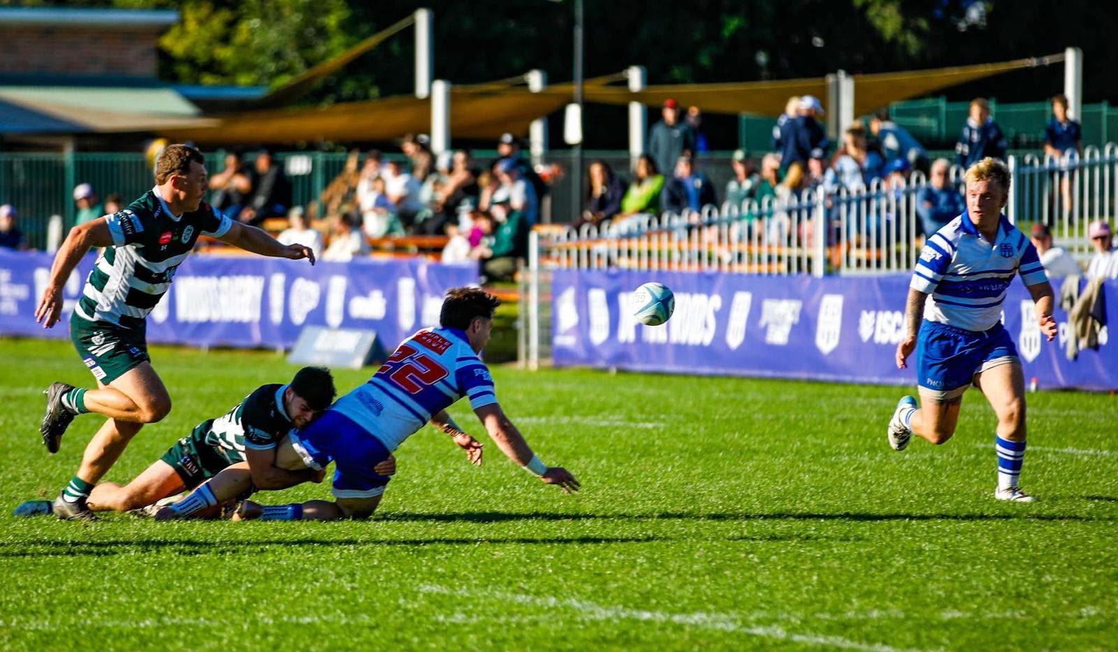 Tom Price releasing a pass after contact