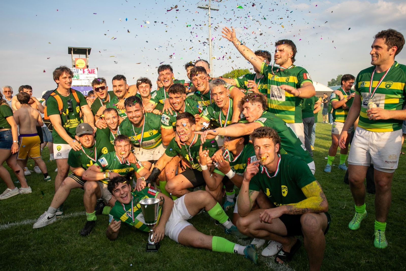Biella Rugby players celebrating with the trophy after the Italian Serie A grand final